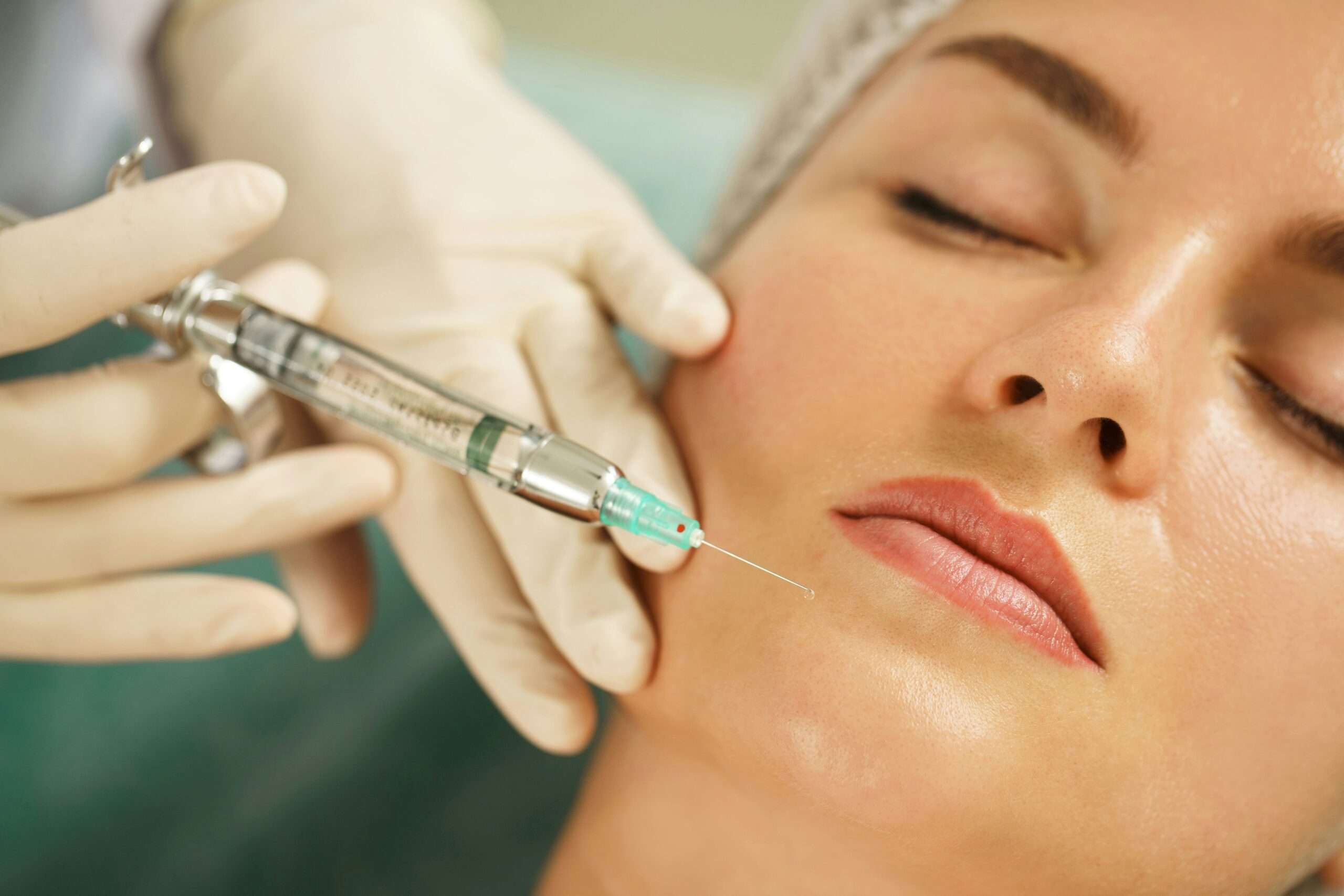 Woman receiving injection in chin